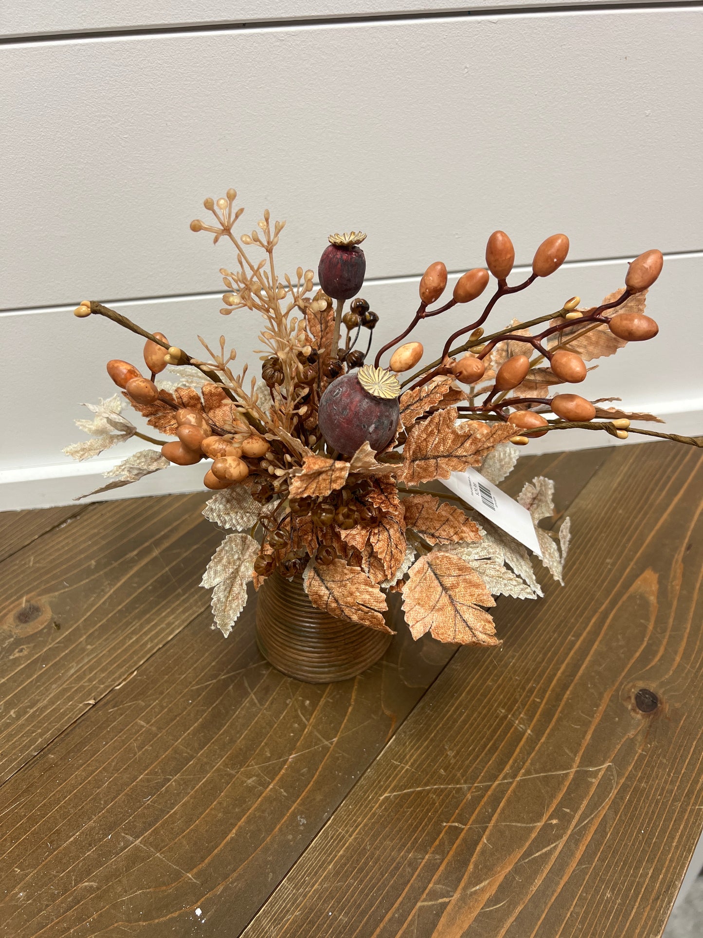 Pod and leaves in brown container