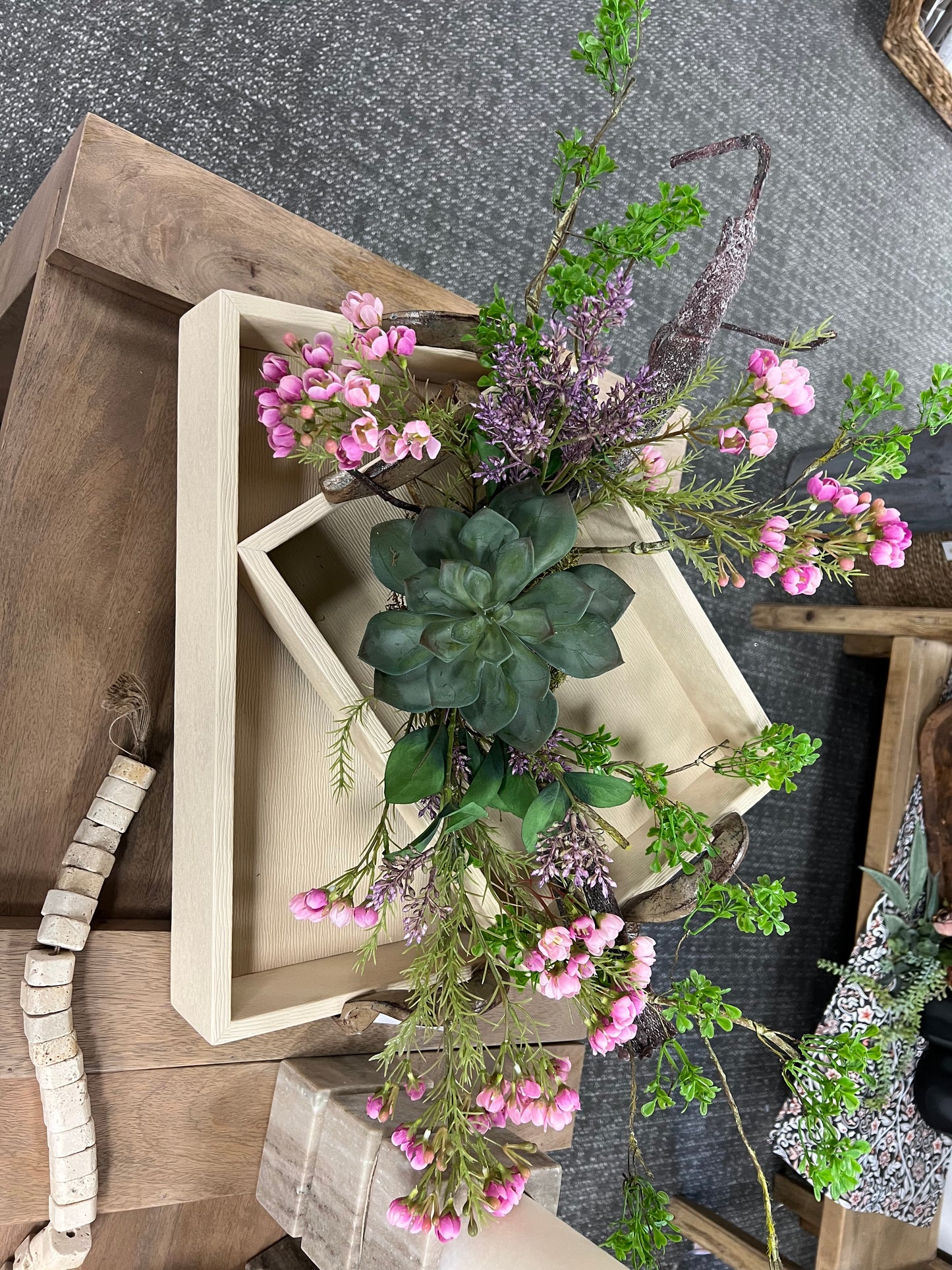 Succulent with pink florals and greens wrapped Arrangement