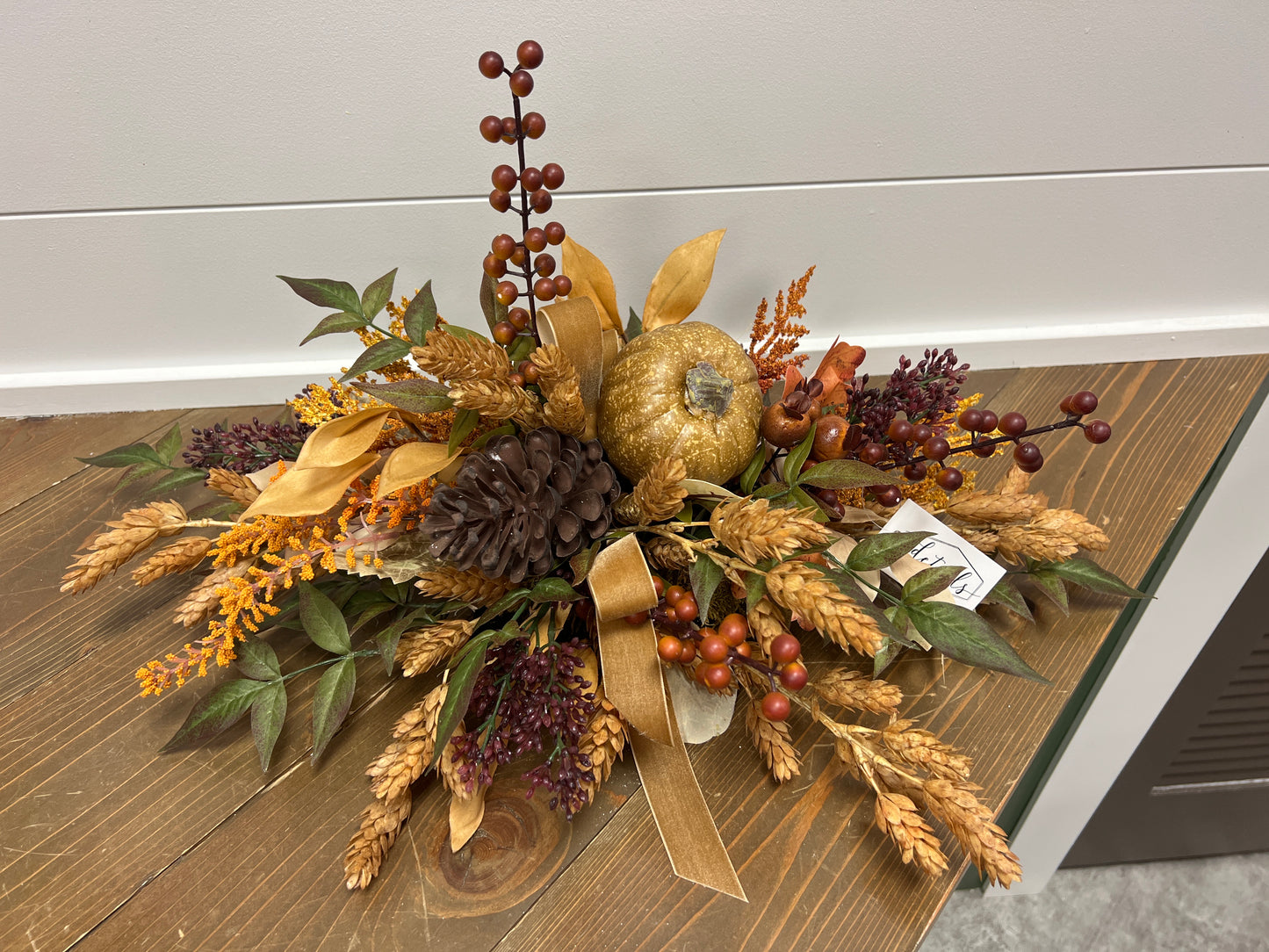 Pumpkin with berry and pinecone