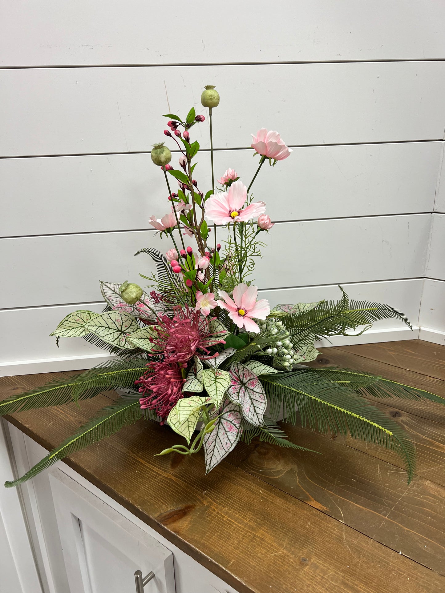 Pink Cosmos with Greenery in Cement Boat